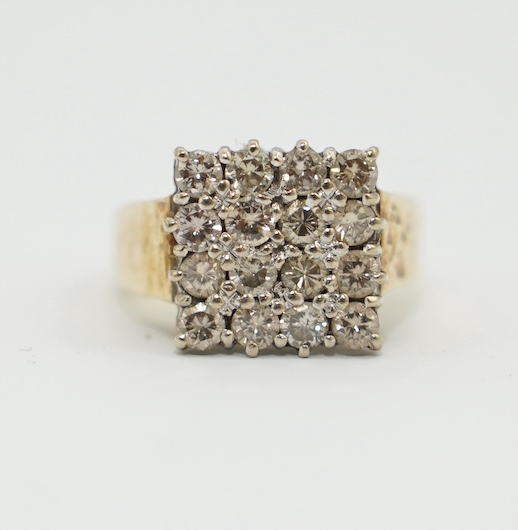 A modern textured 18ct gold and diamond cluster set tablet ring, size K/L, gross weight 6.8 grams. Condition - fair